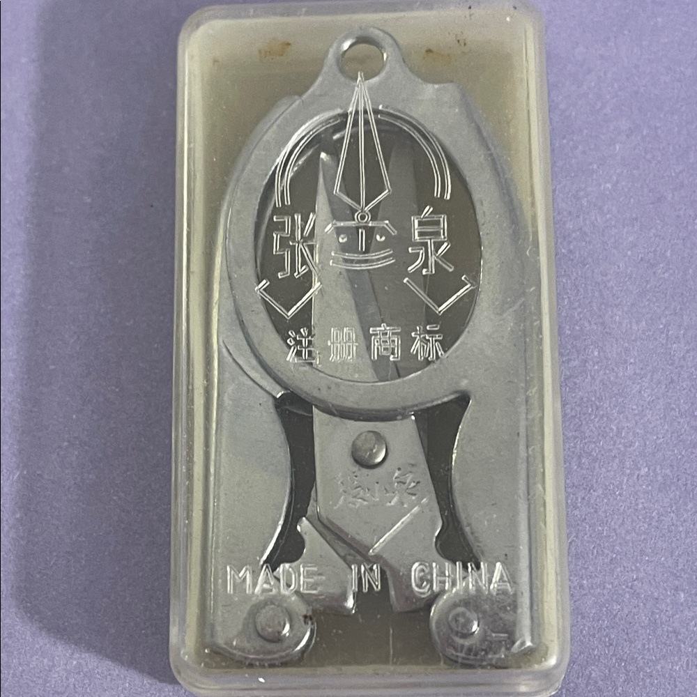 Vintage Chinese folding scissors in plastic bag box